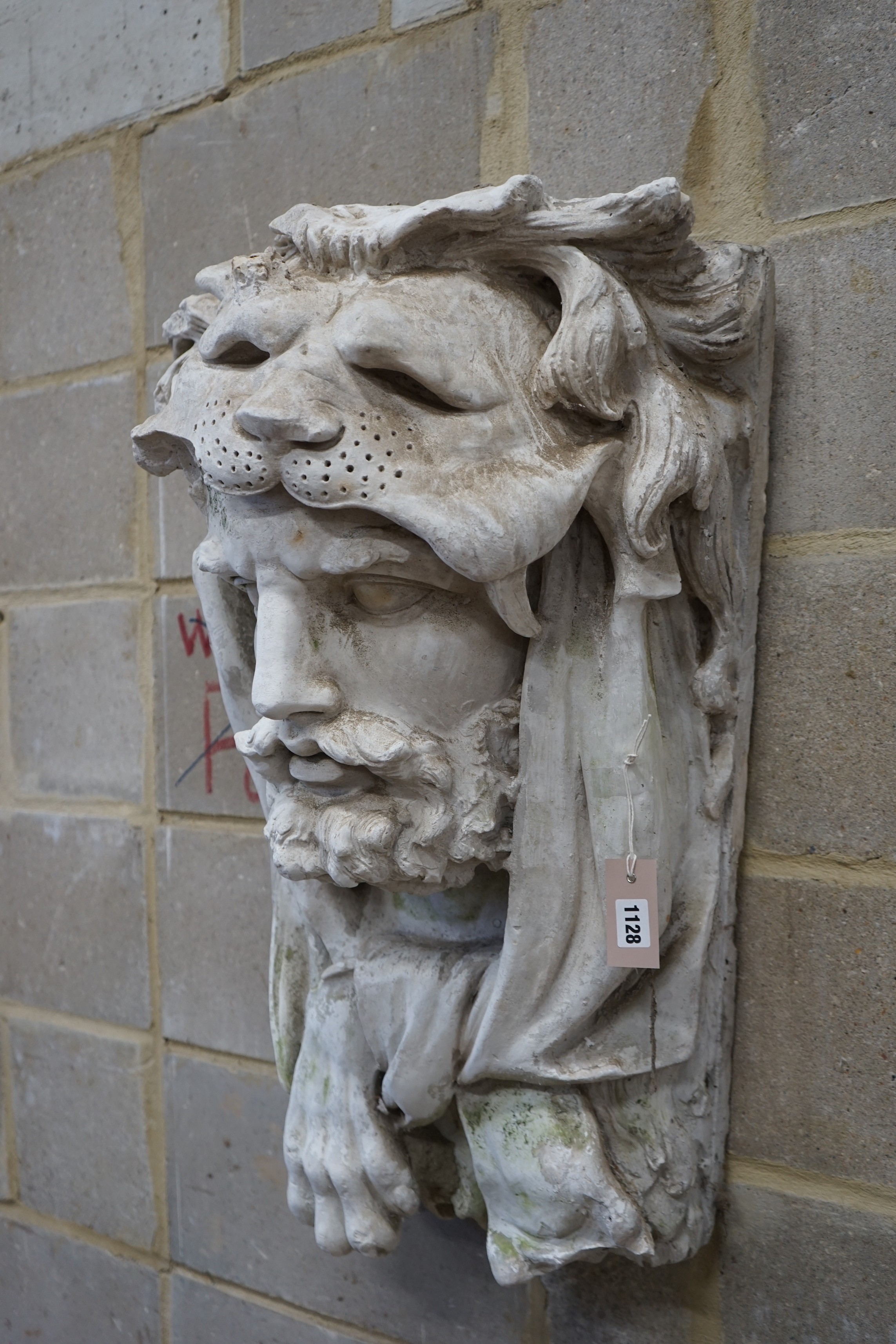 A cast plaster wall mask of Hercules, width 48cm, height 77cm